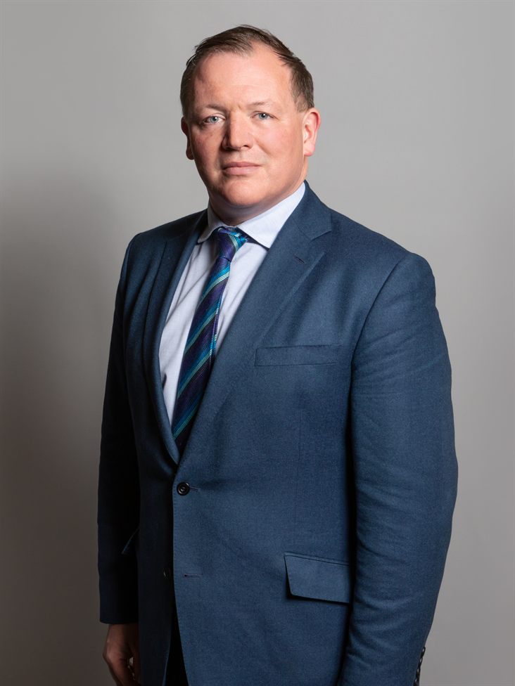 Full sized portrait of Damian Collins