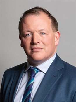 3:4 portrait of Damian Collins