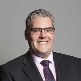 Official portrait of Rt Hon Gavin Robinson MP