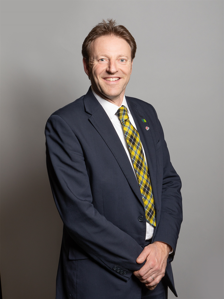 Full sized portrait of Derek Thomas