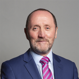 1:1 portrait of Eddie Hughes