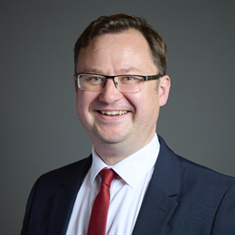 1:1 portrait of Alex Norris