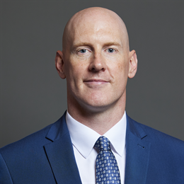 1:1 portrait of Dr Kieran Mullan