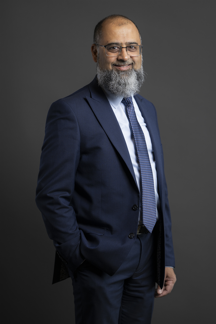 Full sized portrait of Iqbal Mohamed